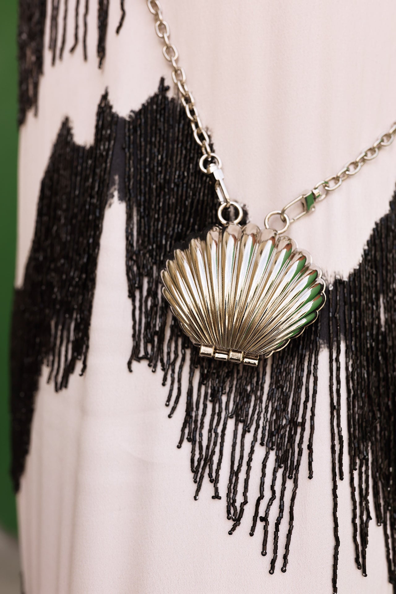 shell necklace, shell bag, fringe details, fringe fashion details